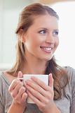 Close up of smiling woman with a cup of tea
