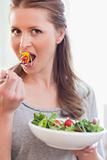 Close up of woman eating salad