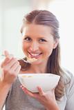 Close up of smiling woman having breakfast