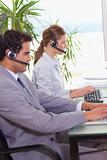Call center agents working next to each other