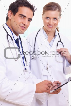 Assistant doctors with tablet