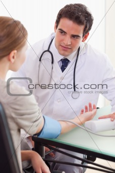 Doctor talking to his patient about her blood pressure