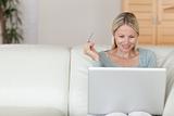 Woman shopping online on the sofa