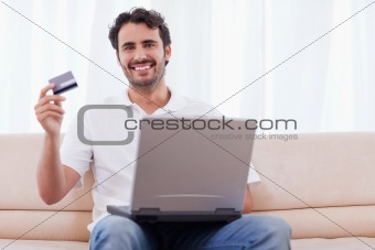 Happy man buying online