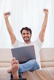 Portrait of a cheerful man buying online