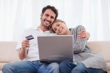 Smiling couple shopping online