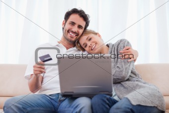 Smiling couple shopping online