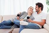 Young couple having a glass of red wine