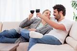 Young couple having a glass of wine