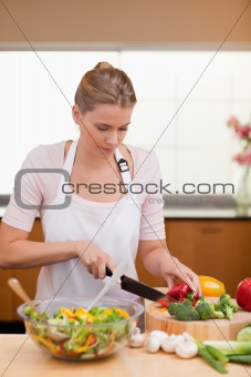 Portrait of a woman slicing vegetables