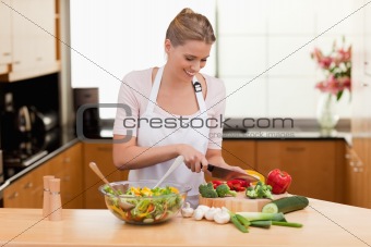 Woman slicing vegetables