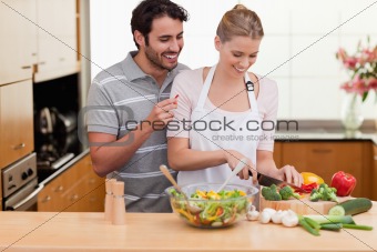 Couple slicing vegetables