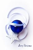 Blue christmas ball with ribbon and star