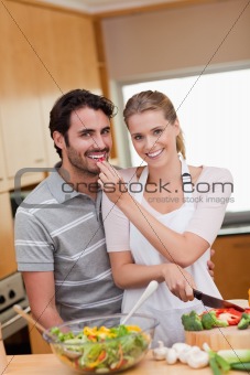 Portrait of a charming couple cooking
