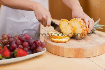 Close up of a pineapple being sliced
