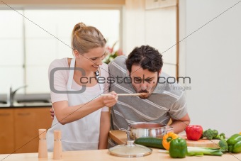 Couple preparing a sauce
