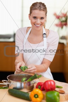 Portrait of a smiling woman cooking