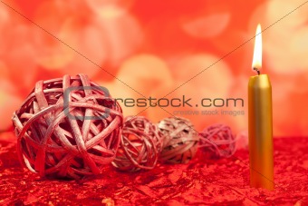 christmas candles with dried baubles on red