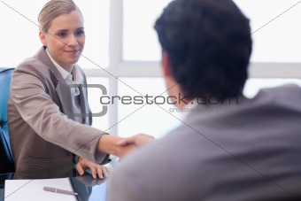 Businesswoman receiving a customer