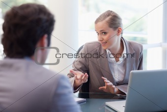 Cute businesswoman receiving a customer