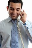 Businessman communicating by telephone