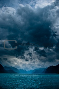 Fjord with dark clouds