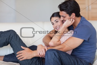 In love couple cuddling each other
