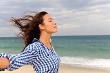 woman enjoying the wind and the sea