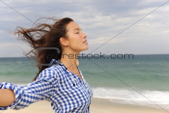 woman enjoying the wind and the sea