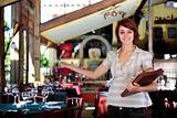 small business: proud female owner of a restaurant