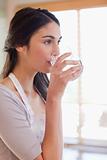 Portrait of a woman drinking water