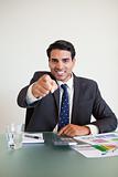 Portrait of a angry businessman pointing at the viewer