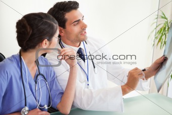 Professional doctors looking at a set of X-ray