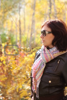 Attractive woman in sun glasses in autumn