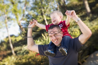 Young Laughing Father and Child  Having Piggy Back Fun.