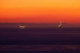 Offshore Oil Rig Drilling Platforms at Sunset