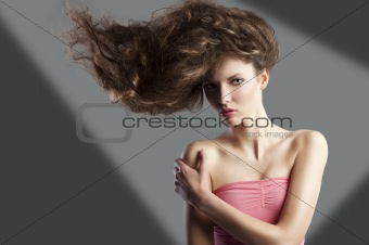 pretty girl with great hair style, she has left hand on the righ