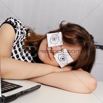 Woman sleeps in the office during working hours