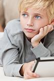 Blond Hair Blue Eyes Boy Child Using Tablet Computer