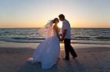 Bride & Groom Married Couple Kissing Sunset Beach Wedding