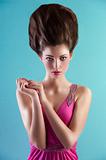 woman in pink with creative hair style