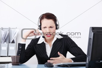 Beautiful business woman shouting through the headphones.
