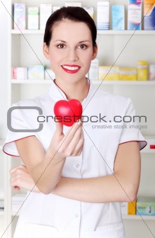 Pharmacist holding heart.