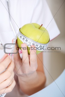 Closeup on measuring apple.