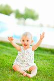 Happy baby playing on grass
