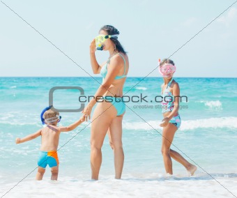 Happy family snorkeling