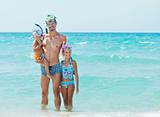 Happy family snorkeling