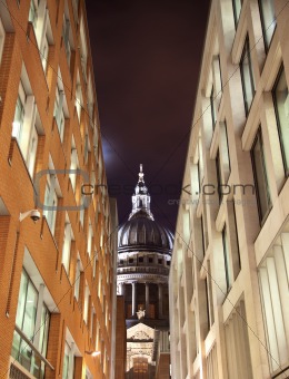 St Paul's cathedral through a street with business buildings