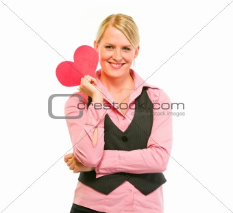 Happy female business clerk holding Valentine paper heart
