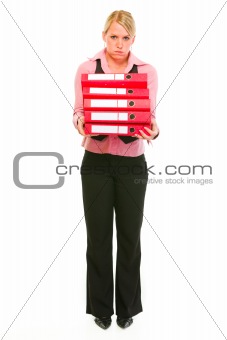 Tired female business secretary holding folders stack
